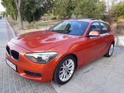 Naranja Usado 2012 BMW 118 Sport Line Utilitario | 11.599 € (Un poco caro)