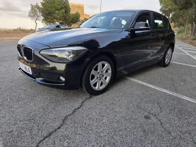Usado BMW 116 116 CV (85 kW) 2012 Negro Utilitario