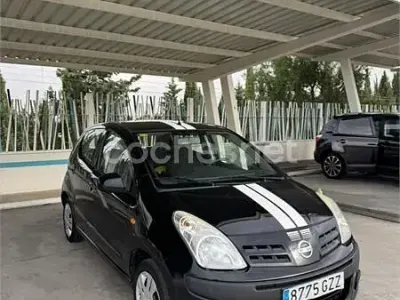 Usado Nissan Pixo Acenta 68 CV (50 kW) 2010 Negro Utilitario