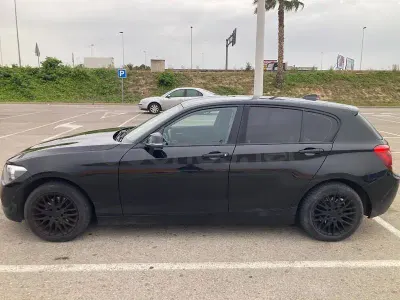 Usado BMW 118 Comfort Edition 143 CV (105 kW) 2012 Negro Utilitario
