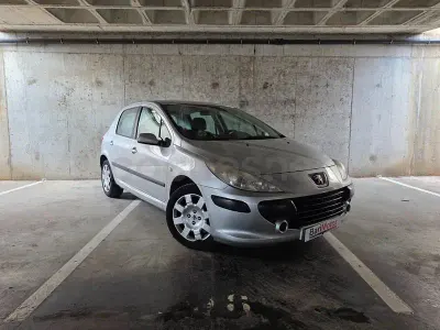 Usado Peugeot 307 110 HP (80 kW) 2006 Cinzento Sedan
