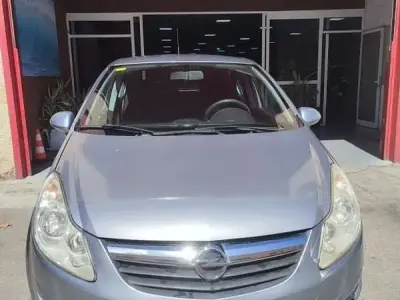 Usado Opel Corsa 75 CV (55 kW) 2010 Gris Utilitario