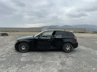 Usado BMW 118 Sport Line 143 CV (105 kW) 2009 Negro Utilitario