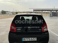 Usado Nissan Pixo Acenta 68 CV (50 kW) 2010 Negro Utilitario