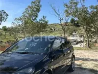 Używany Opel Astra Cosmo 110 KM (80 kW) 2010 Czarny Sedan/Limuzyna
