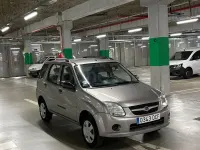 Usado Suzuki Ignis 69 CV (50 kW) 2005 Gris / plata Utilitario