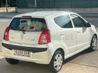 Usado Nissan Pixo Acenta 68 CV (50 kW) 2010 Blanco Utilitario
