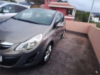 Usado Opel Corsa Cosmo 85 CV (62 kW) 2011 Granate Utilitario