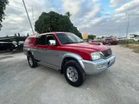 Usado Mitsubishi L200 114 CV (83 kW) 2004 Rojo Pickup/Camioneta