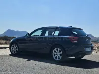 Usado BMW 118 Sport Line 143 CV (105 kW) 2012 Azul Utilitario