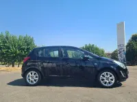 Usado Opel Corsa Selective 85 CV (62 kW) 2013 Negro Utilitario