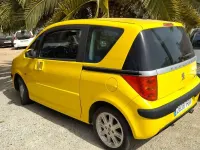Usado Peugeot 1007 69 CV (50 kW) 2006 Amarillo Monovolumen