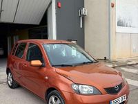 Usado Mazda 2 82 CV (60 kW) 2005 Naranja Utilitario