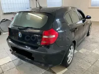 Usado BMW 116 122 CV (89 kW) 2008 Negro Utilitario