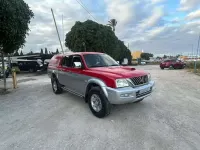 Usado Mitsubishi L200 114 CV (83 kW) 2004 Rojo Pickup/Camioneta