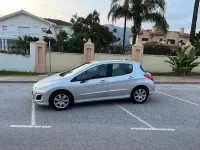 Usado Peugeot 308 Access 120 HP (88 kW) 2012 Cinzento Citadino