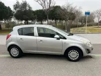 Usado Opel Corsa Expression 75 CV (55 kW) 2011 Gris Utilitario