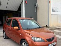 Usado Mazda 2 Active 68 CV (50 kW) 2005 Naranja Utilitario