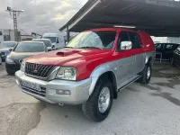 Usado Mitsubishi L200 114 CV (83 kW) 2004 Rojo Pickup/Camioneta