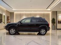 Käytetty Hyundai Tucson Comfort 140 HP (102 kW) 2006 Musta Katumaasturi