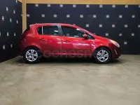 Usado Opel Corsa Selective 85 CV (62 kW) 2013 Granate Utilitario