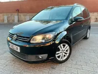 Begagnad VW Touran Advance 105 HK (77 kW) 2012 Svart Minibuss