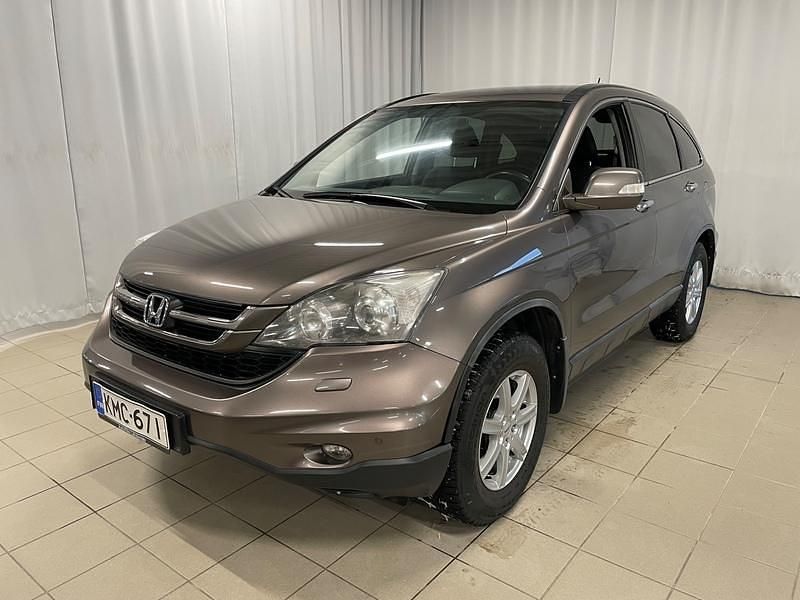 Ruskea Käytetty 2012 Honda CR-V Katumaasturi | 14 900 € (Perustarjous) - Kuva 1/4