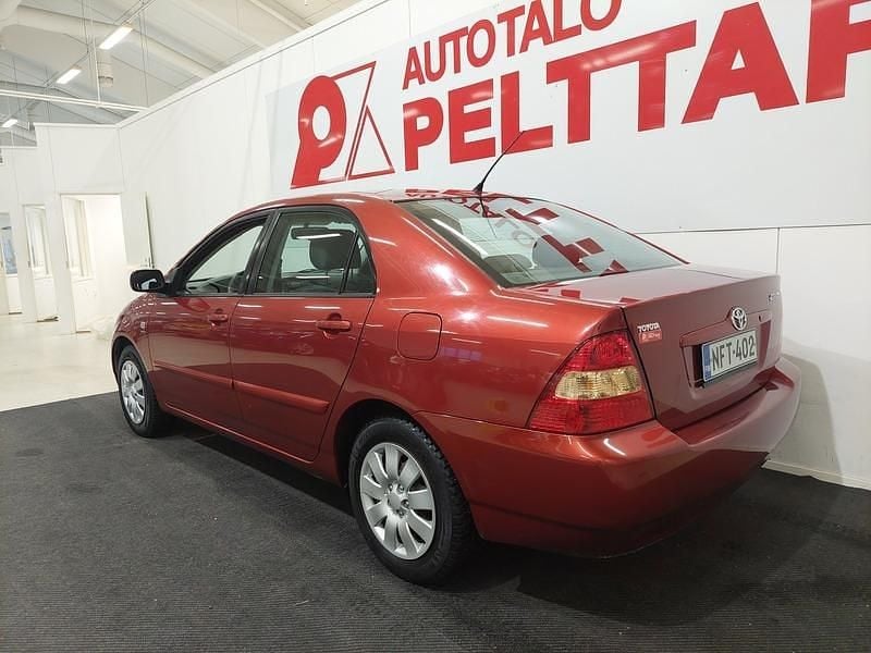 Käytetty Toyota Corolla Terra 110 HP (80 kW) 2004 Punainen Sedan