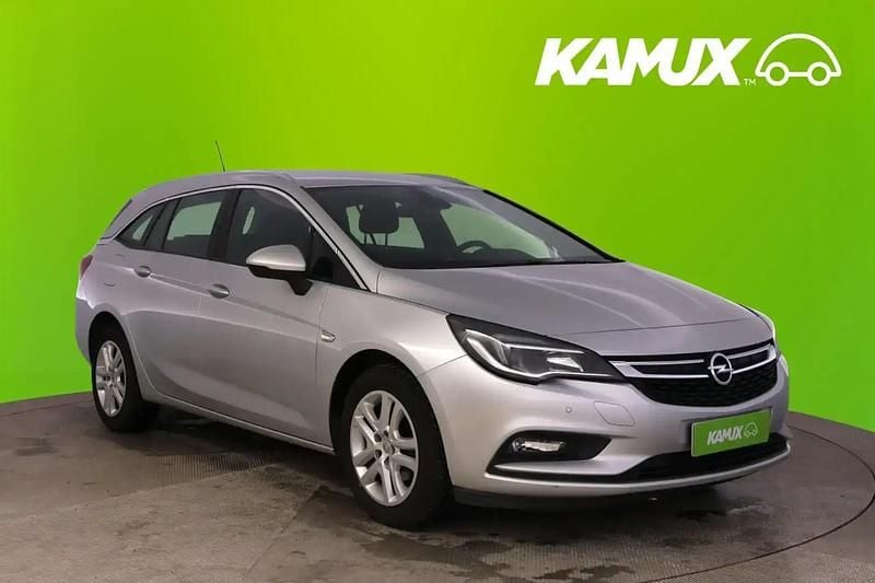 Hopea / harmaa Käytetty 2016 Opel Astra Enjoy Farmari | 9 490 € (Hyvä tarjous) - Kuva 1/4
