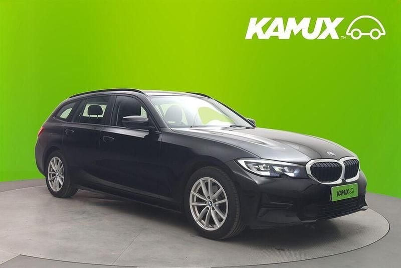 Musta Käytetty 2021 BMW 320 Farmari | 27 880 € (Perustarjous) - Kuva 1/3