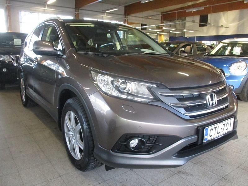 Ruskea Käytetty 2015 Honda CR-V Elegance Katumaasturi | 20 980 € (Perustarjous) - Kuva 1/4