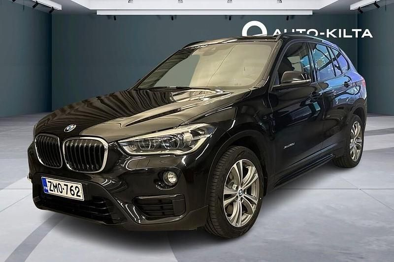 Musta Käytetty 2015 BMW X1 Sport Line Katumaasturi | 18 850 € (Hieman kallis) - Kuva 1/4