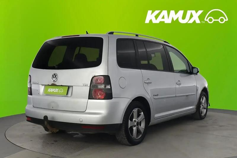 Käytetty VW Touran Freestyle 105 HP (77 kW) 2009 Hopea / harmaa Tila-auto