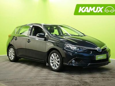 Hopea / harmaa Käytetty 2015 Toyota Auris Hybrid Active Sedan | 11 880 € (Perustarjous)