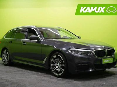 Hopea / harmaa Käytetty 2019 BMW 520 M Sport Farmari | 21 600 € (Hieman kallis)