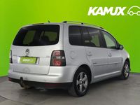 Käytetty VW Touran Freestyle 105 HP (77 kW) 2009 Hopea / harmaa Tila-auto