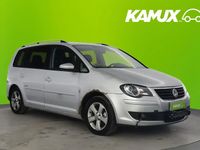 Käytetty VW Touran Freestyle 105 HP (77 kW) 2009 Hopea / harmaa Tila-auto