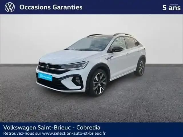 Blanc pur/toit noir Occasion 2022 VW Taigo R-line SUV | 24 990 € (Prix juste) - Image 1/4