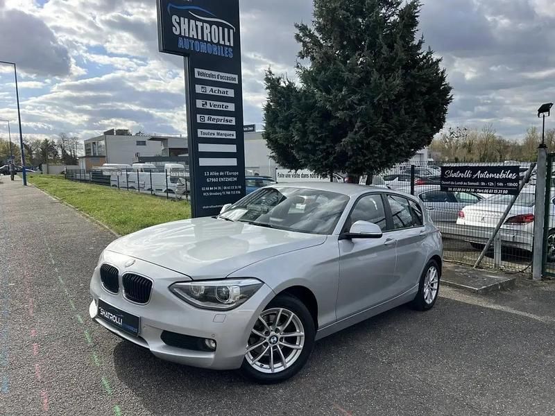 Gris Utilisé 2014 BMW 116 Citadine | 11 990 € (Prix juste) - Image 1/4