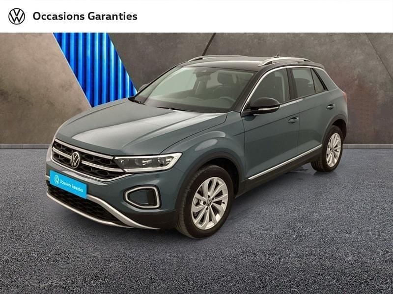 Bleu pétrole métallisée/toit noir Utilisé 2022 VW T-Roc Style SUV | 25 990 € (Bon prix) - Image 1/4
