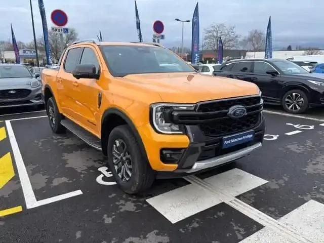Premium metaallak: cyber orange Occasion 2025 Ford Ranger Wildtrack Pick-up | 56 499 € (Prix juste) - Image 1/3