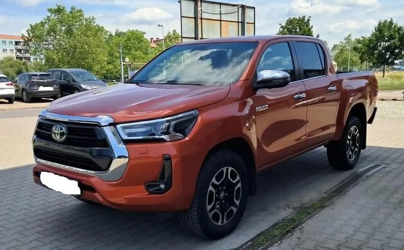 Orange Utilisé 2022 Toyota HiLux Pick-up | 38 900 € (Prix juste) - Image 1/4