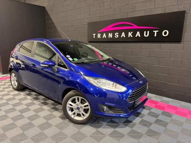 Bleu Occasion 2016 Ford Fiesta Titanium Berline | 7 990 € (Prix assez cher) - Image 1/4