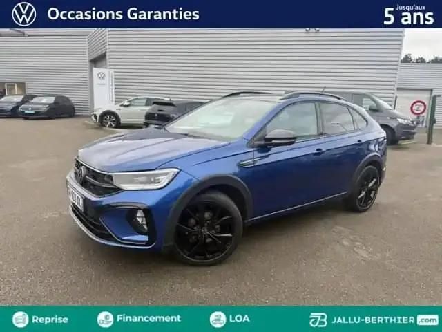 Bleu récif métallisée Occasion 2022 VW Taigo R-line SUV | 24 990 € (Prix juste) - Image 1/4