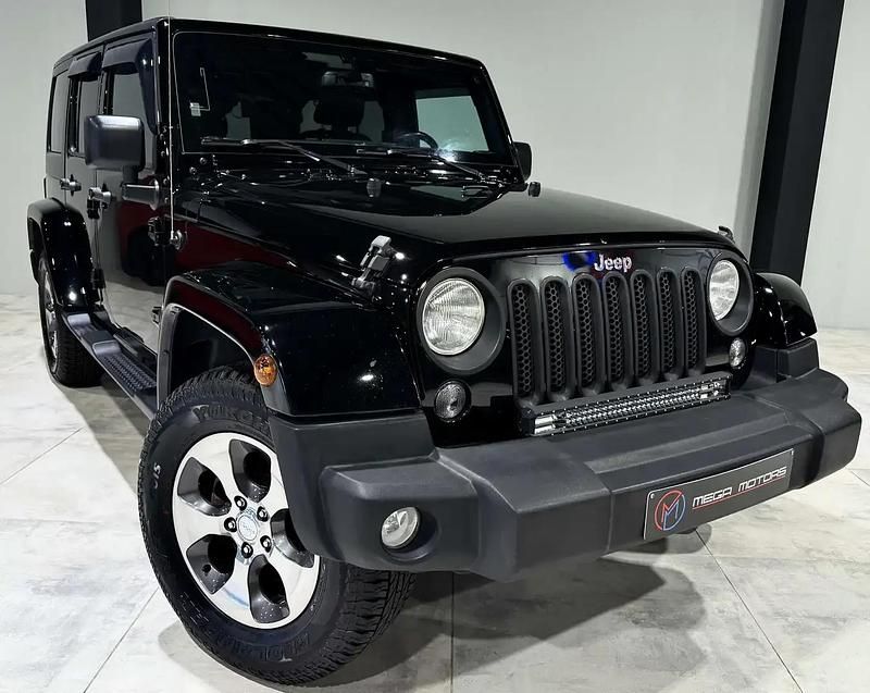 Noir Occasion 2017 Jeep Wrangler Sahara SUV | 29 900 € (Prix juste) - Image 1/4