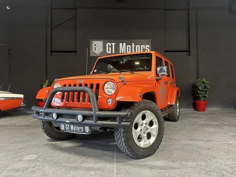 Orange Occasion 2015 Jeep Wrangler Sahara SUV | 24 990 € (Super prix) - Image 1/4