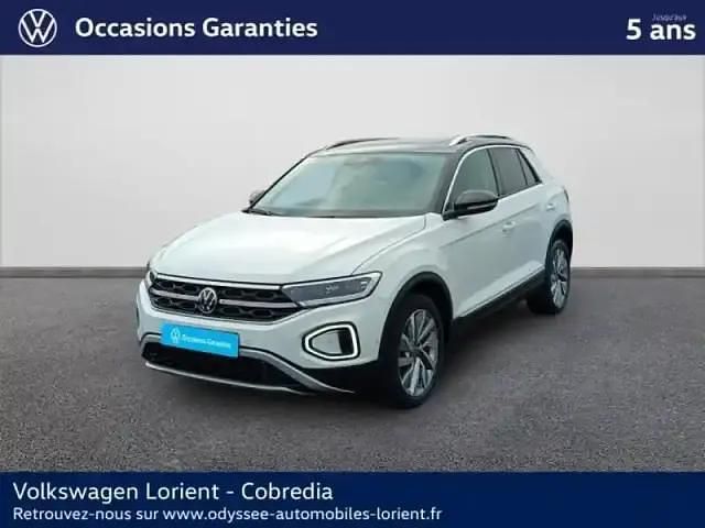 Blanc pur/toit noir Occasion 2023 VW T-Roc Exclusive SUV | 28 490 € (Prix juste) - Image 1/4