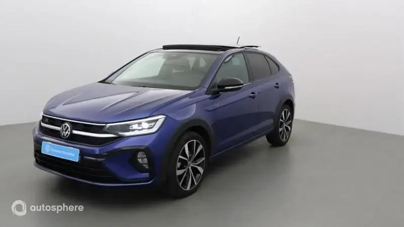 Bleu Utilisé 2024 VW Taigo R-line SUV | 28 799 € (Prix juste) - Image 1/4