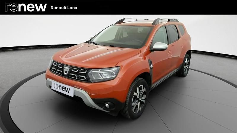 Orange Utilisé 2022 Dacia Duster Prestige SUV | 18 990 € (Prix juste) - Image 1/4