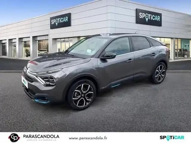 Gris Utilisé 2023 Citroën e-C4 Shine Berline | 23 990 € (Prix assez cher) - Image 1/4